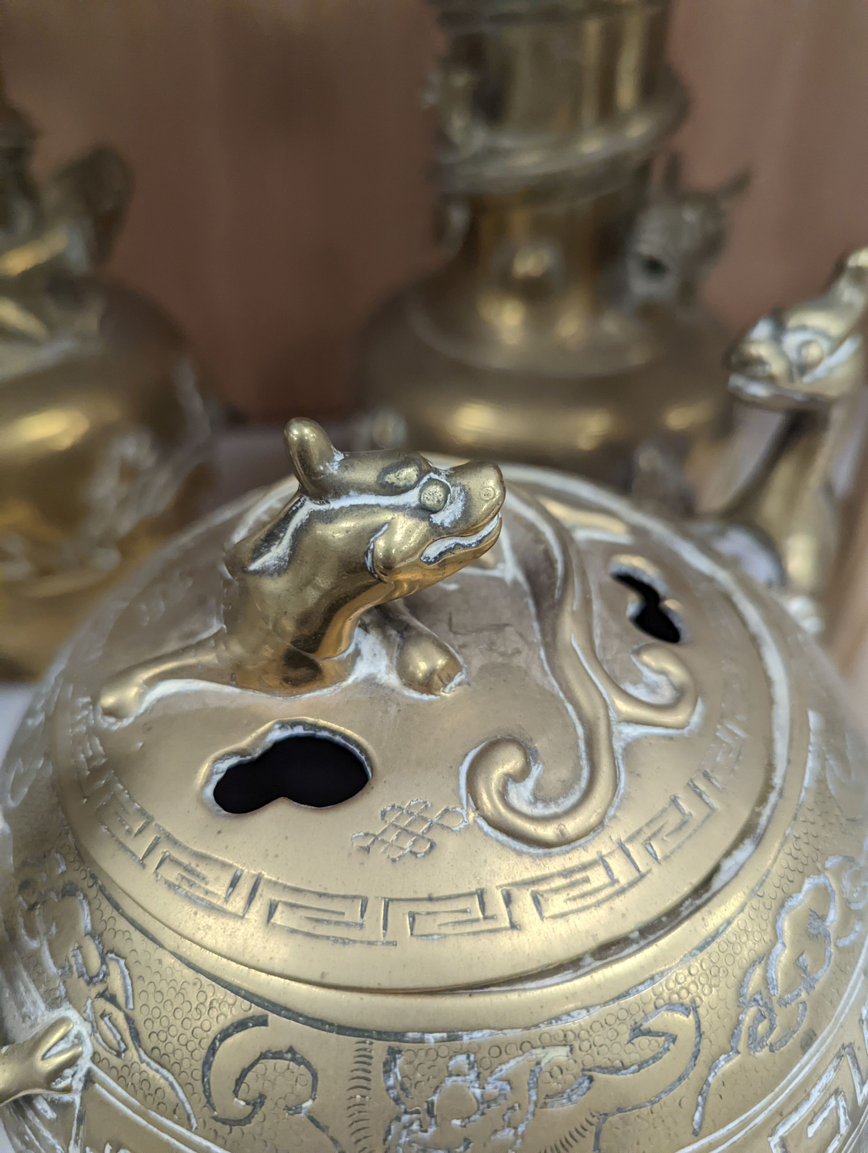 A pair of Chinese brass dragon vases, 26cm, together with two similar incense burners, tallest 30cm high